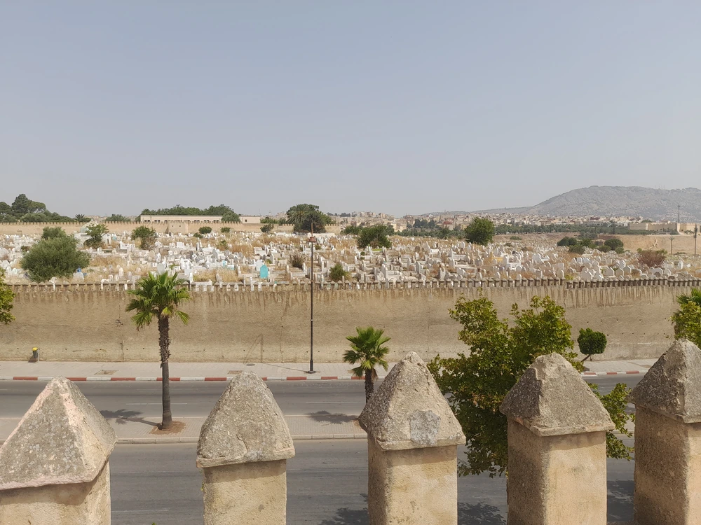 Roofline overlooking the old city walls and cemetery